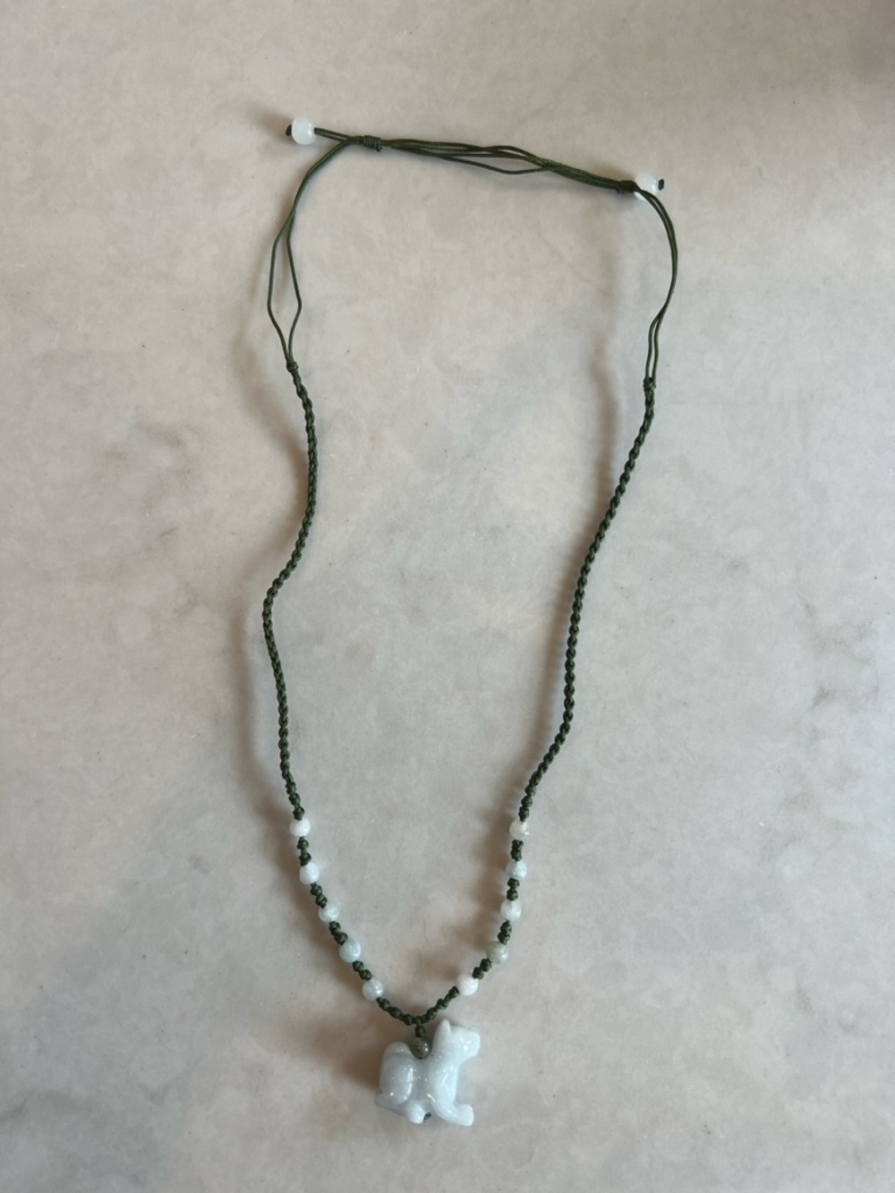 Green Braided Cord Necklace with White Carved Animal Pendant